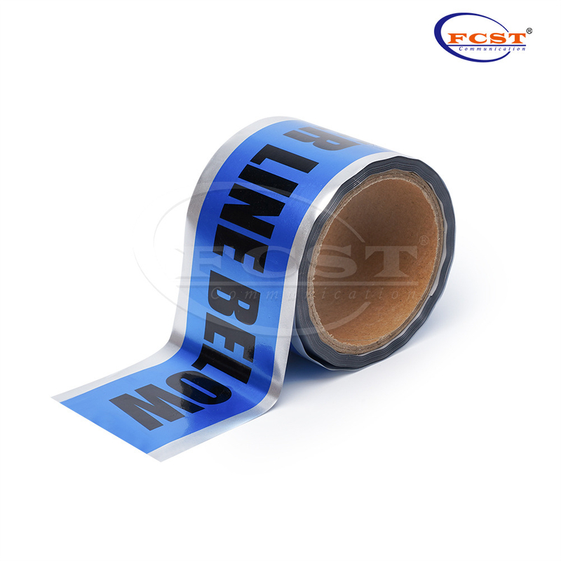 Warning tape applied over buried utilities